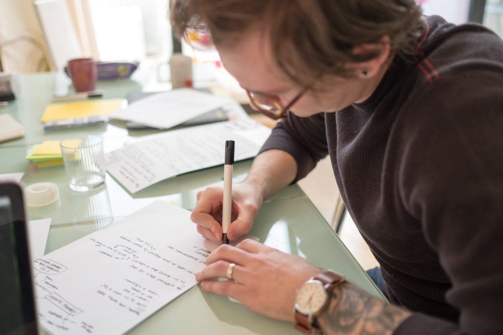 Dan sketching and taking notes on a piece of paper